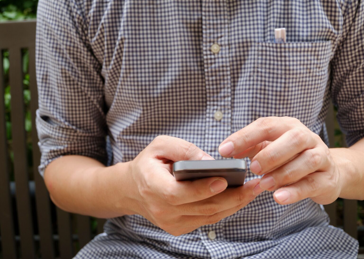Image of a man holding a smartphone