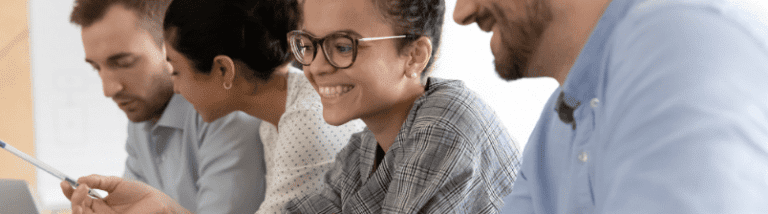 Smiling and working on computers