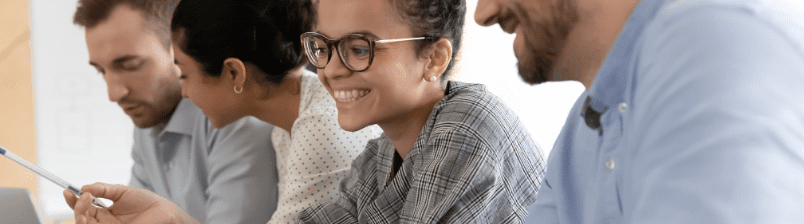 Smiling and working on computers